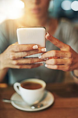 Buy stock photo Cropped shot of a young woman sending an sms while working late in her office