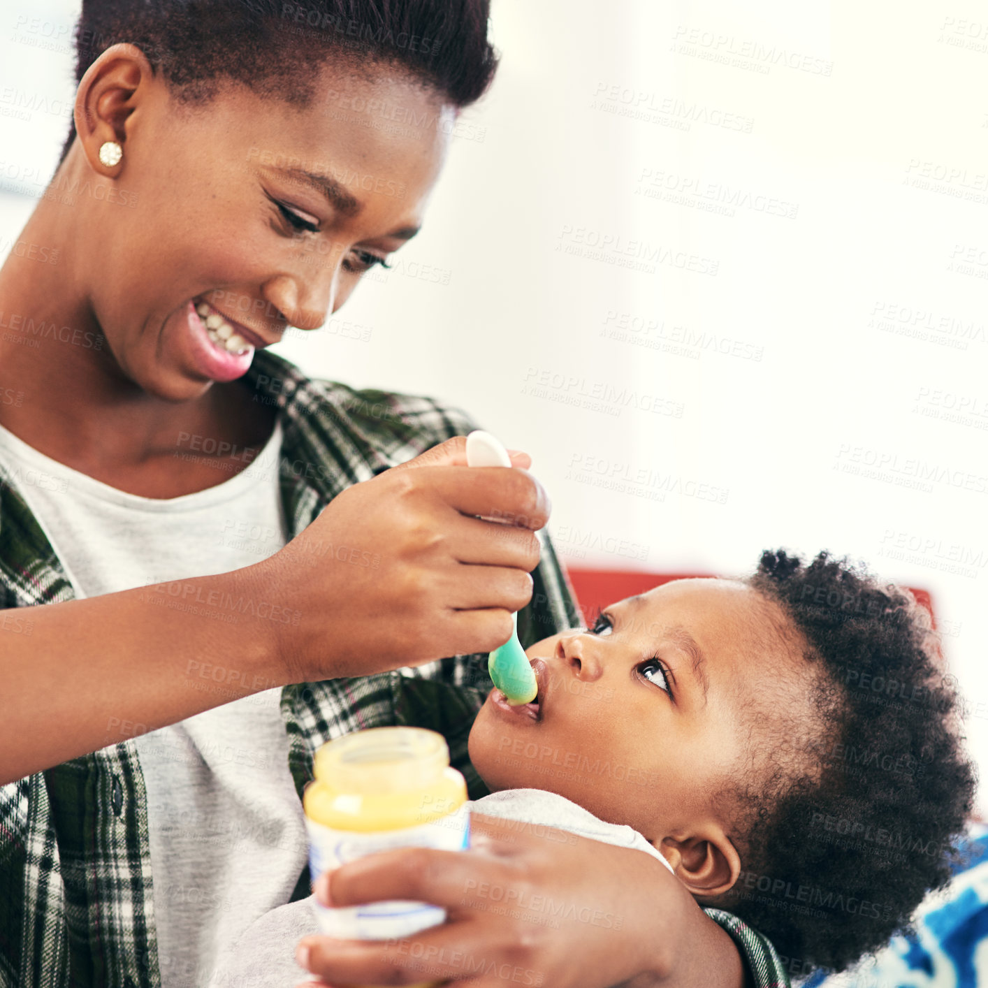 Buy stock photo Mom, baby and happy in home with feeding for nutrition, vitamins and growth for child development. Black people, parent and kid or toddler with meal for bonding or care, support and trust with smile