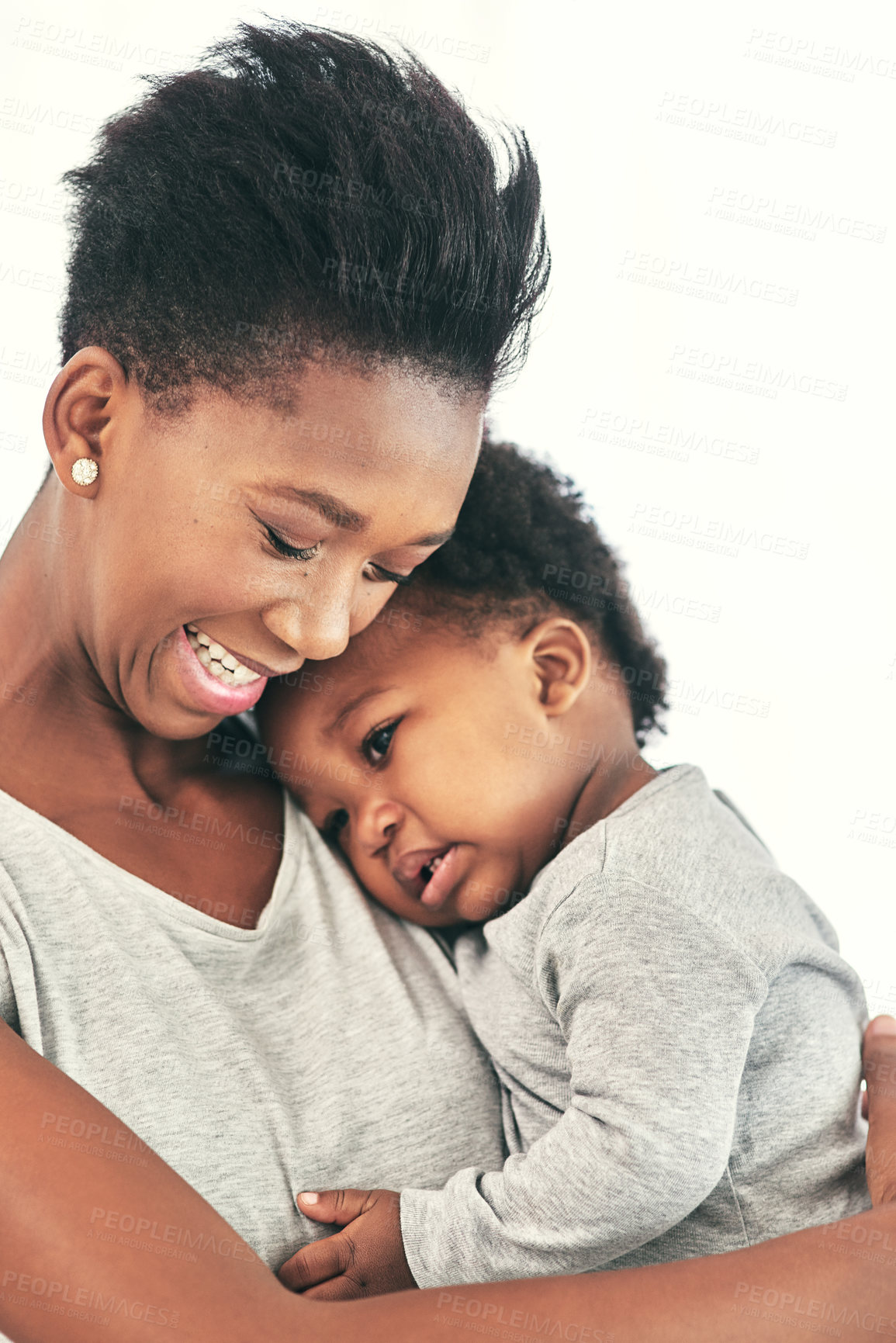Buy stock photo Mom, baby and home with smile on hug for affection, love and support with kindness for child development. Black people, parent and kid or toddler with bonding for care, growth and trust in closeup