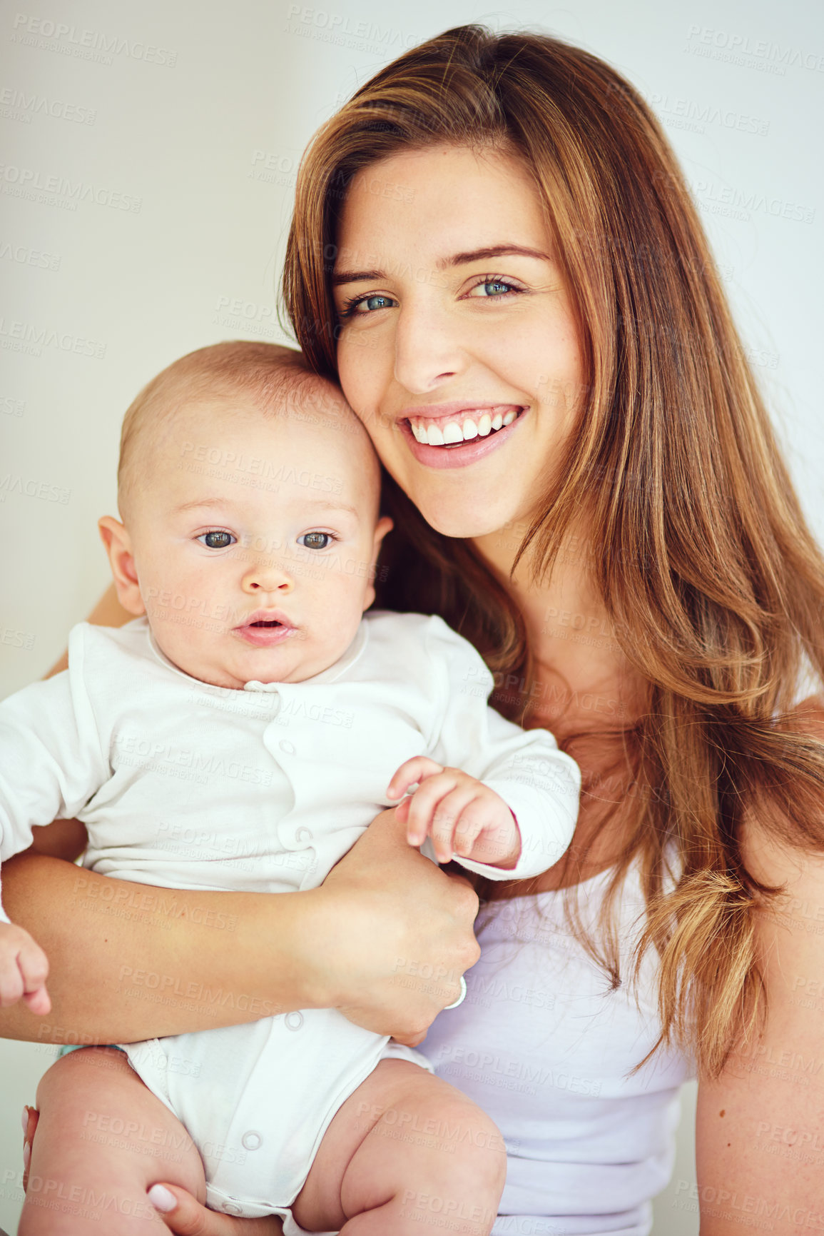 Buy stock photo A beautiful, loving and caring mother holding baby, smiling and looking happy with new born. Single blonde parent or young mom showing love and care for her infant, bonding and smiling together