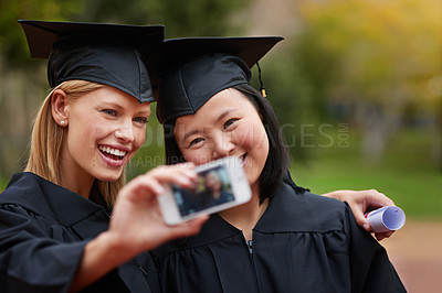 Buy stock photo Selfie, graduation and achievement with student friends on campus together for success at university. Education, certificate and photograph with happy graduate women at college event for scholarship