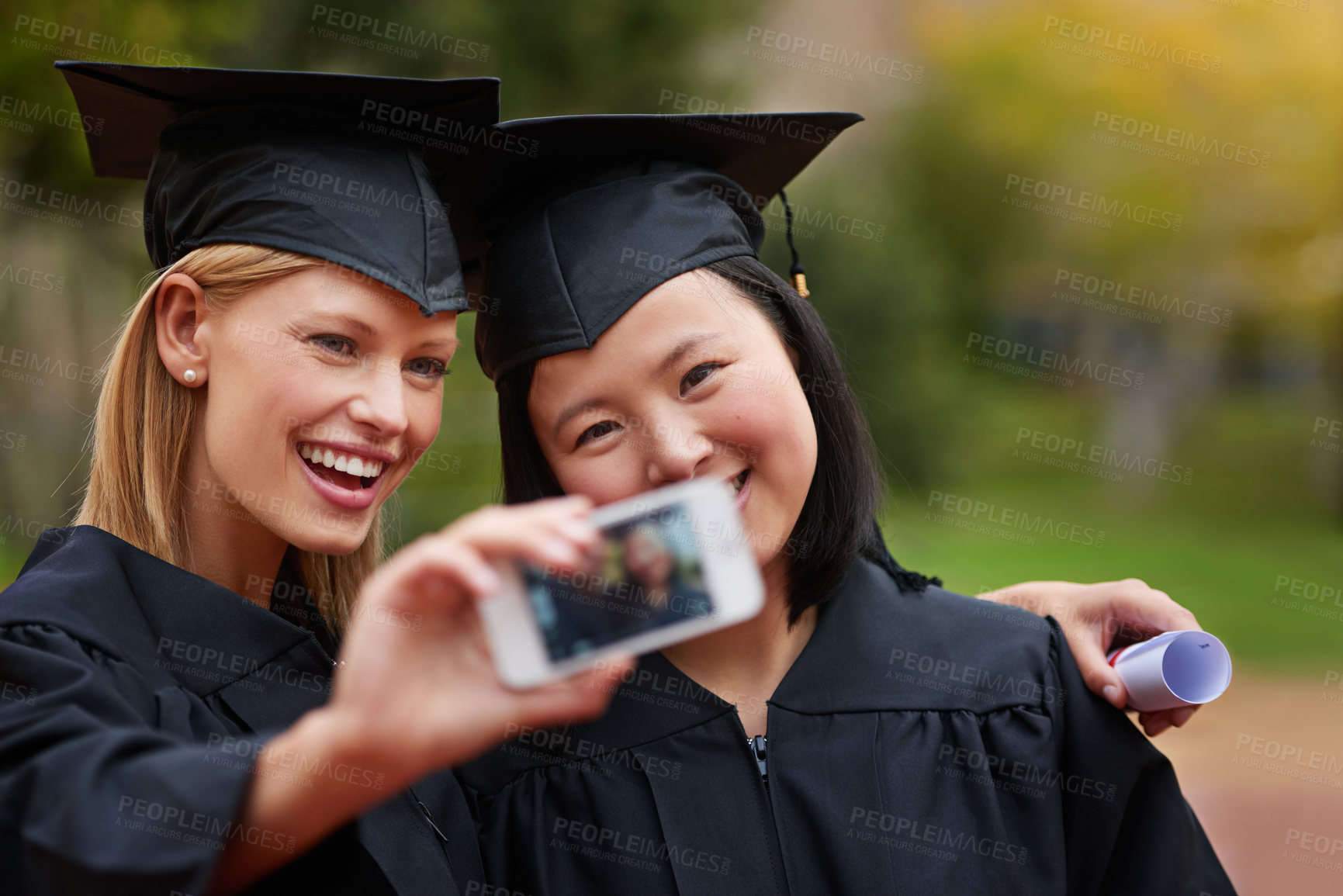 Buy stock photo Selfie, graduation and achievement with student friends on campus together for success at university. Education, certificate and photograph with happy graduate women at college event for scholarship