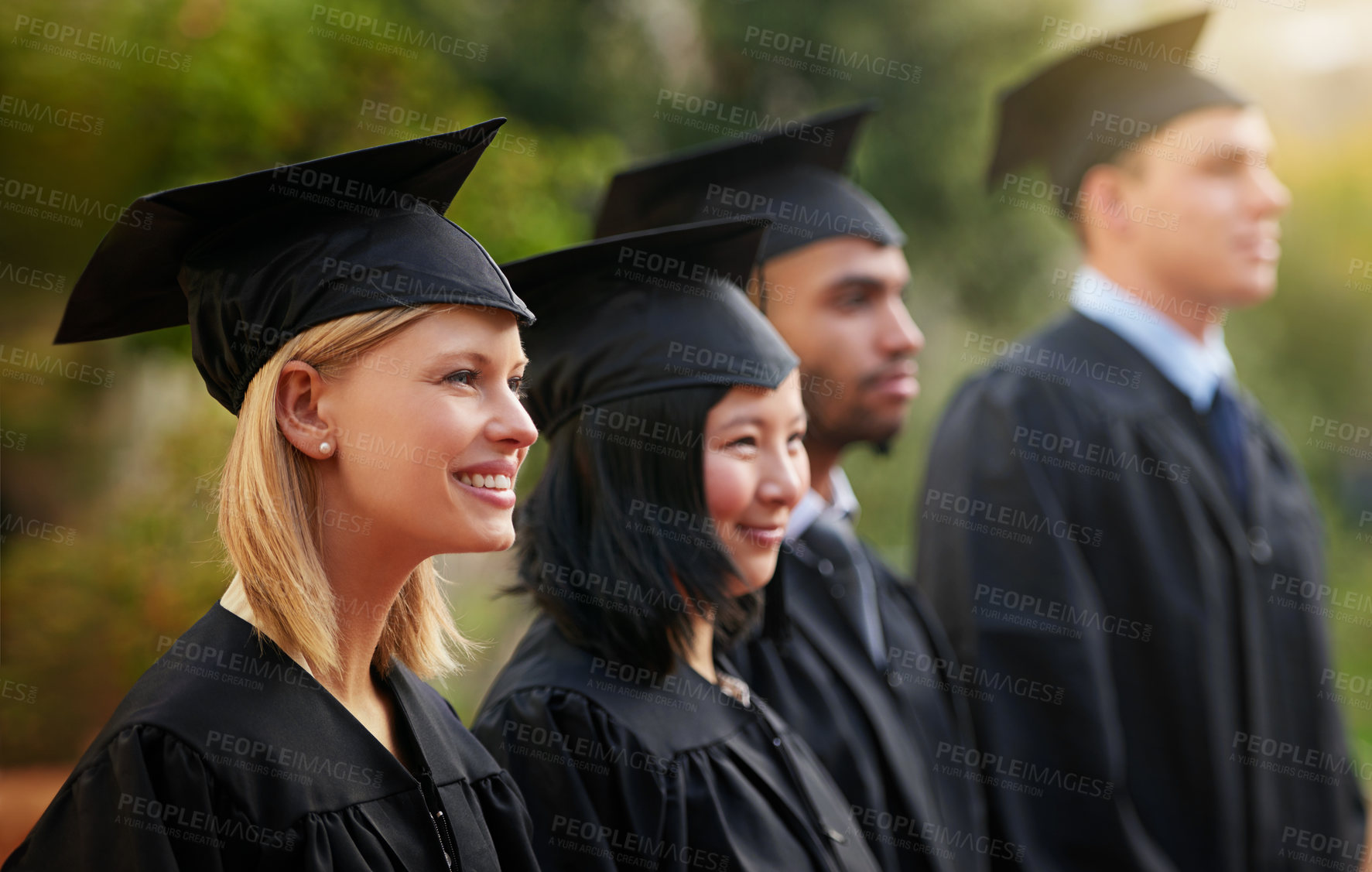 Buy stock photo Smile, graduation and woman student in line with friends at outdoor ceremony for college or university. Education, scholarship or achievement with graduate men and women at academic school event