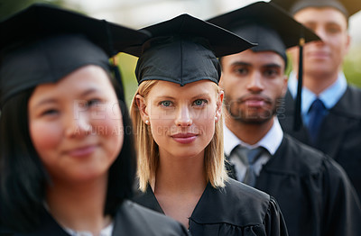 Buy stock photo Portrait, graduation and woman student in row with friends for university or college ceremony outdoor. Face, education and scholarship with serious young person on campus for success or achievement