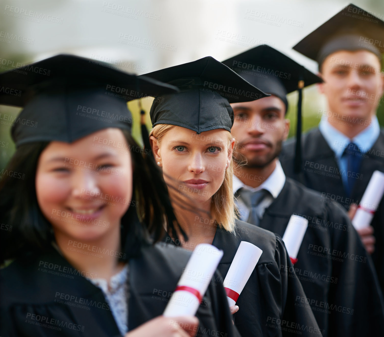 Buy stock photo Portrait, graduation and woman in line with friends at college or university for ceremony of achievement. Education, certificate and scholarship with group of young graduate people outdoor on campus