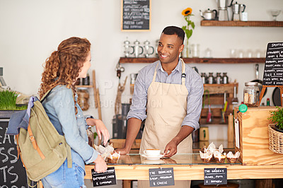 Buy stock photo Barista, cafe and customer service with order, drink and talking with smile for support or hospitality at counter. Small business owner or waiter with latte, student and sale at coffee shop or bakery