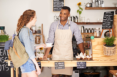 Buy stock photo Coffee shop, small business and barista serving customer in bakery, cafe or deli for retail or food industry. Smile, startup or bistro and happy man server or waiter in restaurant with woman consumer