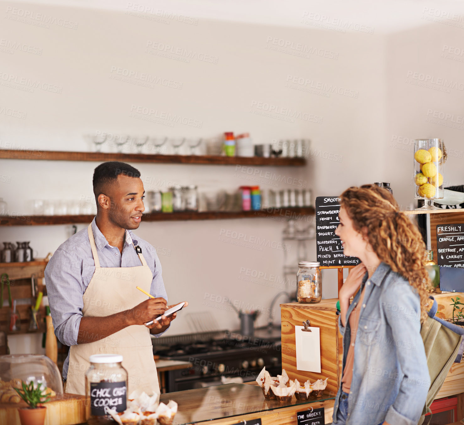 Buy stock photo Woman, coffee shop and waiter with writing at counter for shopping, purchase and lunch at cafe. Female person, small business and barista with notepad for discussion, order and customer service