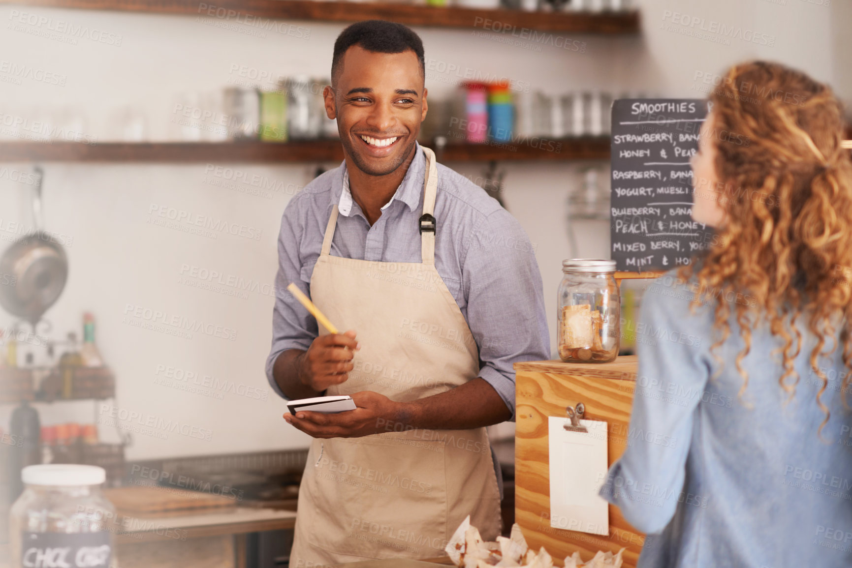 Buy stock photo Customer, cafe and waiter with order at counter for purchase, decision and buying lunch at coffee shop. Woman, small business and male barista with notepad for service, writing and choice on menu