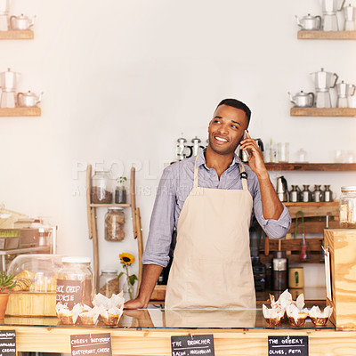 Buy stock photo Planning, smile and phone call with black man in coffee shop for communication, networking or service. Cafe, restaurant and thinking with happy young small business owner or vendor working in bakery