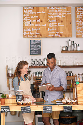 Buy stock photo Coffee shop owners, tablet and teamwork of people, manage orders and discussion in store. Waiters, black man and happy woman in cafe with technology for inventory, stock check and managing sales.