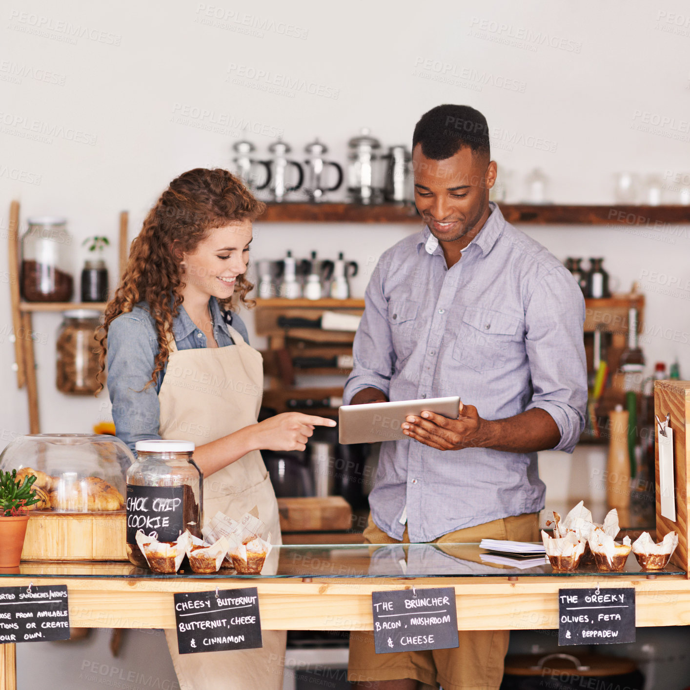 Buy stock photo Employees, man and woman with a tablet, talking and update system with happiness, profit growth or store. Partners, manager or worker with technology, work schedule or collaboration with digital plan