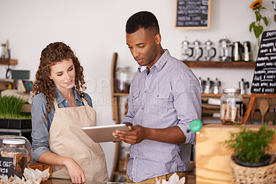Buy stock photo Tablet, cafe barista and teamwork of people, discussion and training in coffee shop. Waiters, black man and woman in restaurant with technology for inventory, stock check or managing sales in store.