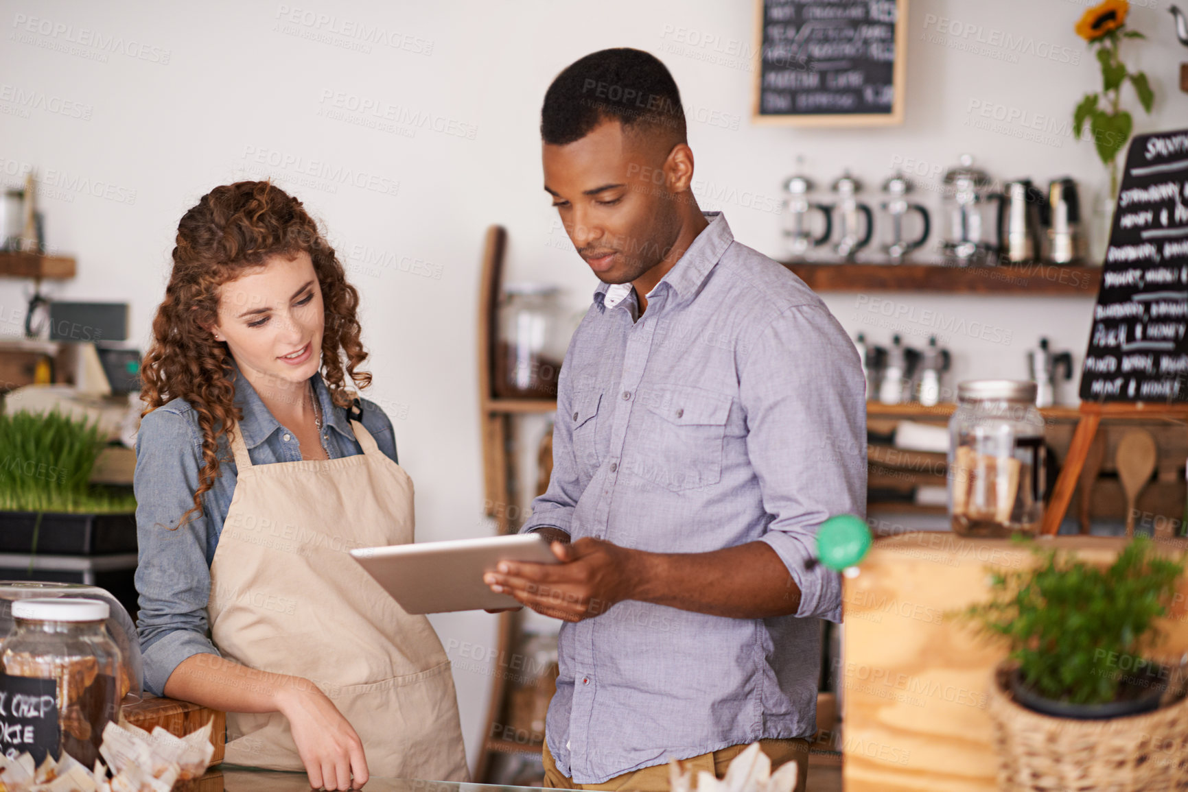 Buy stock photo Tablet, cafe barista and teamwork of people, discussion and training in coffee shop. Waiters, black man and woman in restaurant with technology for inventory, stock check or managing sales in store.