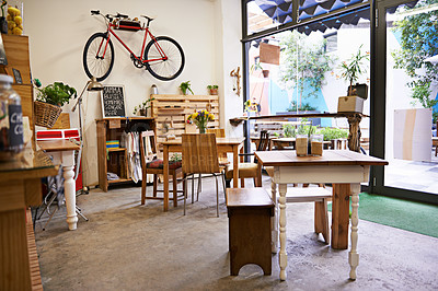 Buy stock photo Coffee shop, empty interior and space with table, chairs and furniture or small business, bistro and cafe with unique design and style. Background, creative startup and food store with bike on wall