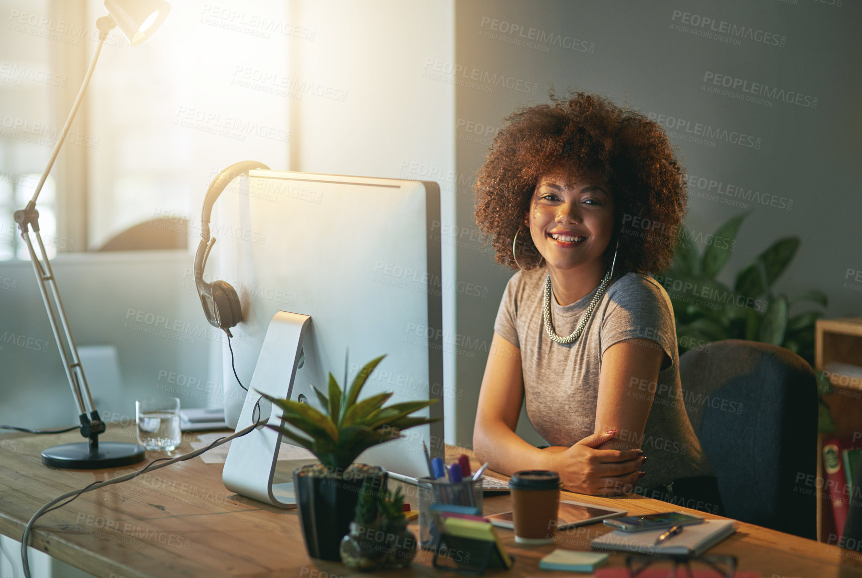 Buy stock photo Portrait of a successful young woman working a late shift at the office