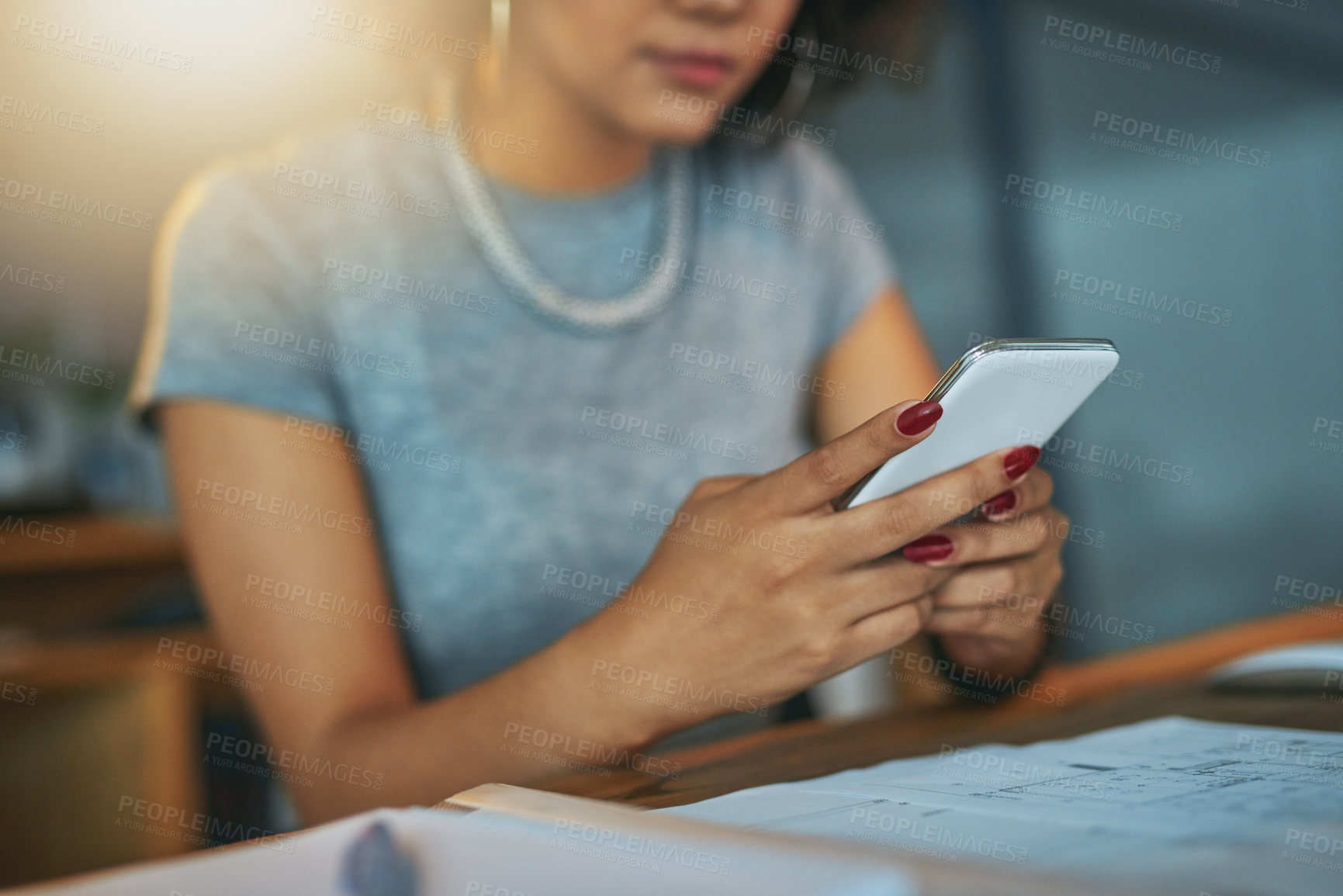 Buy stock photo Night, hands and woman at desk with phone, typing and search on social media website for architecture. Smartphone, scroll and designer on mobile app for article, email or online chat in dark office