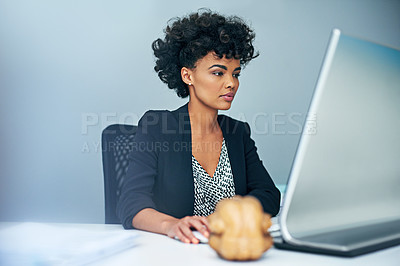 Buy stock photo Shot of a businesswoman sitting at her computer in an office