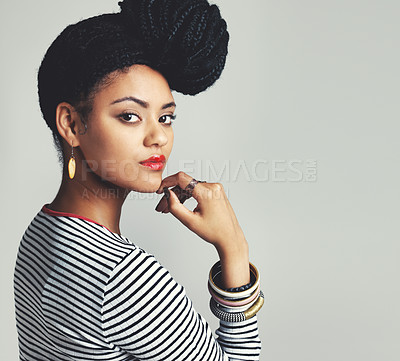 Buy stock photo Studio shot of a fashionable young woman posing against a grey background