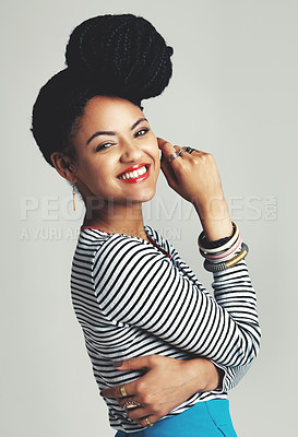 Buy stock photo Studio shot of a fashionable young woman posing against a grey background