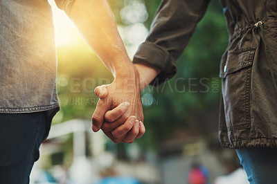 Buy stock photo Closeup shot of a loving couple holding hands
