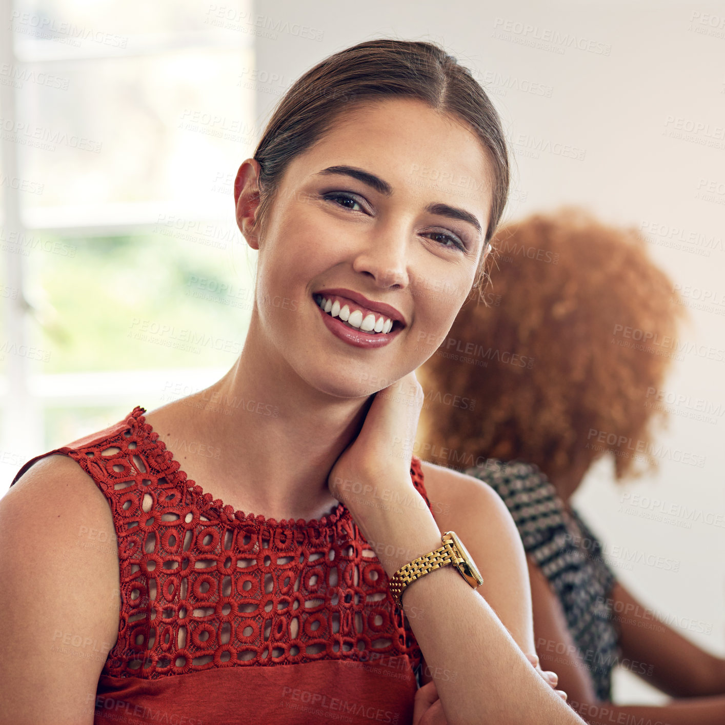 Buy stock photo Portrait of a smiling young designer sitting in an office with colleagues in the background