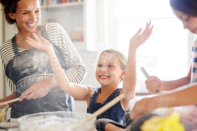 Buy stock photo Family, girls and mother baking, kitchen and excited with love, child development and bonding. Mama, female children and kids with ingredients, fun and playful with quality time, home and daughters