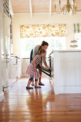 Buy stock photo Mother, oven or kid baking in kitchen as a happy family with a young girl learning cookies recipe at home. Cake, girl baker or mom helping or teaching daughter to bake in stove for child development 