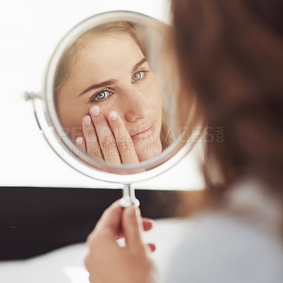 Buy stock photo Woman, mirror and anti aging in home, bathroom and skincare or cosmetic dermatology for wrinkles. Wellness, eye or reflection or collagen treatment for worry, fine lines and check for textured skin