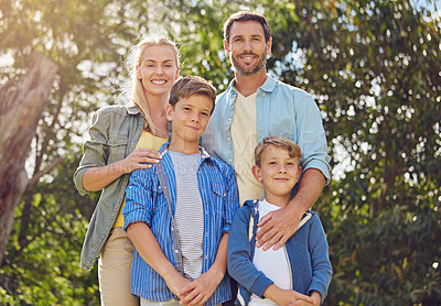 Buy stock photo Cropped portrait of a family of four walking in the woods