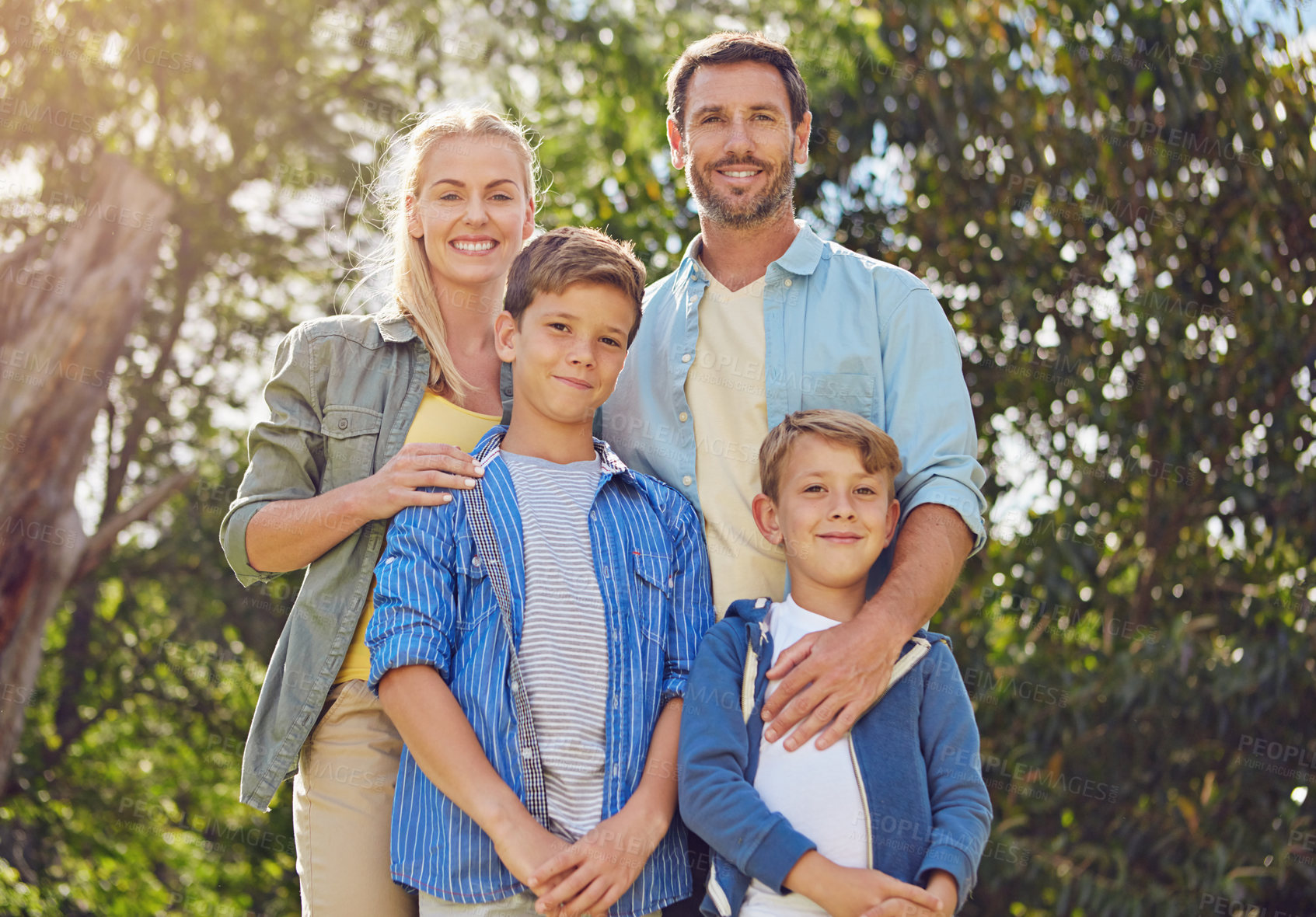 Buy stock photo Cropped portrait of a family of four walking in the woods