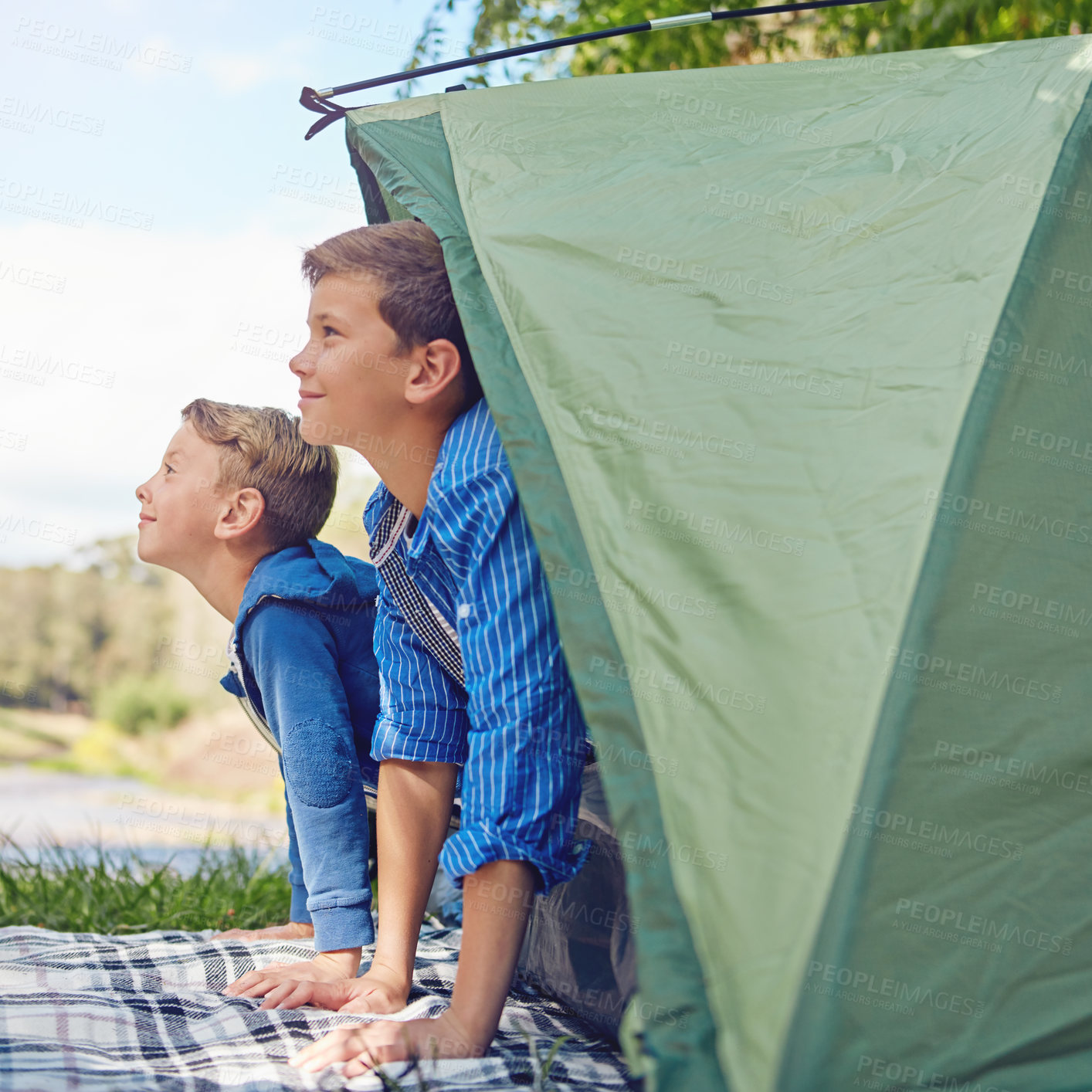 Buy stock photo Cropped shot of two young brothers exiting in their tent