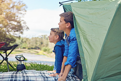 Buy stock photo Cropped shot of two young brothers exiting in their tent