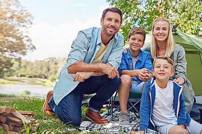 Buy stock photo Cropped portrait of a family of four camping in the woods