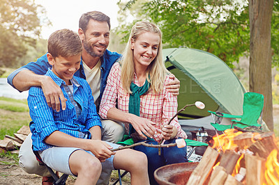 Buy stock photo Cropped shot of a family of three camping in the woods