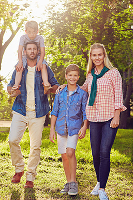 Buy stock photo Full length shot of a family of four walking in the woods