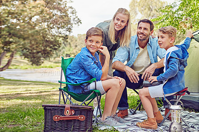 Buy stock photo Shot of a family of four camping in the woods