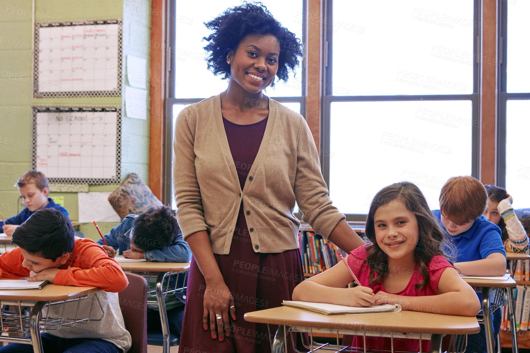 Buy stock photo Shot of a teacher in a classroom with her students