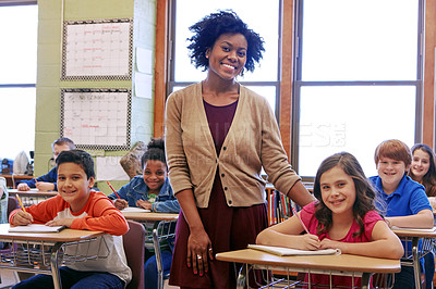 Buy stock photo Education, learning and teacher in classroom with kids writing exam or test at Montessori school. Portrait of black woman, happy children at desk and monitoring growth and development for school kids