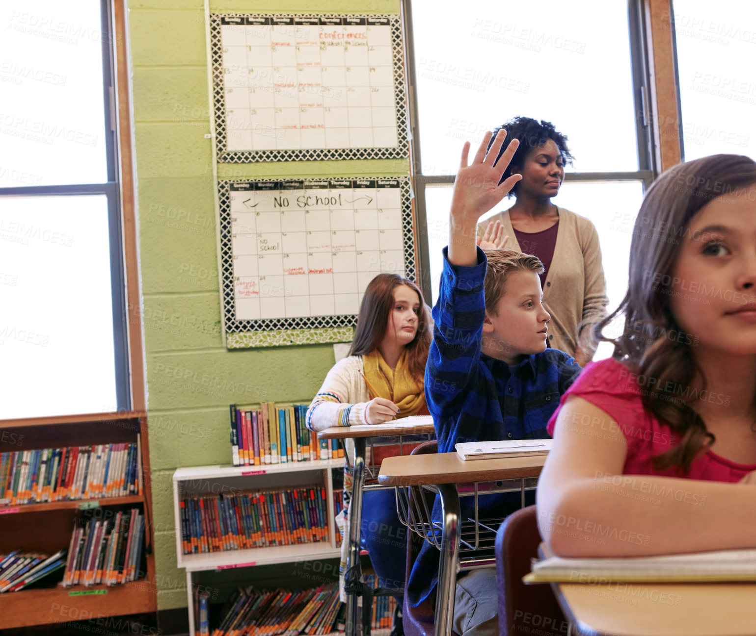 Buy stock photo Classroom, children and hand up for answer, education and students with academic growth or learning. Elementary school, teacher and boy with gesture for question, knowledge and cognitive development