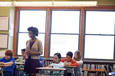 Buy stock photo School, teacher and children in student classroom for education, knowledge and development. Black woman in class to teach diversity kids or students together for learning, studying and writing test