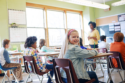 Buy stock photo Classroom, children and education portrait of a girl writing to learn, study and gain knowledge. Diversity group students or kids in language class while learning for future, development and growth