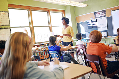 Buy stock photo Shot of a elementary children and their teacher in a lesson at school