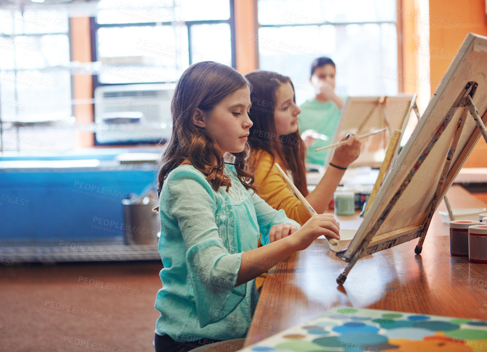 Buy stock photo Shot of a young schoolgirl in an art class