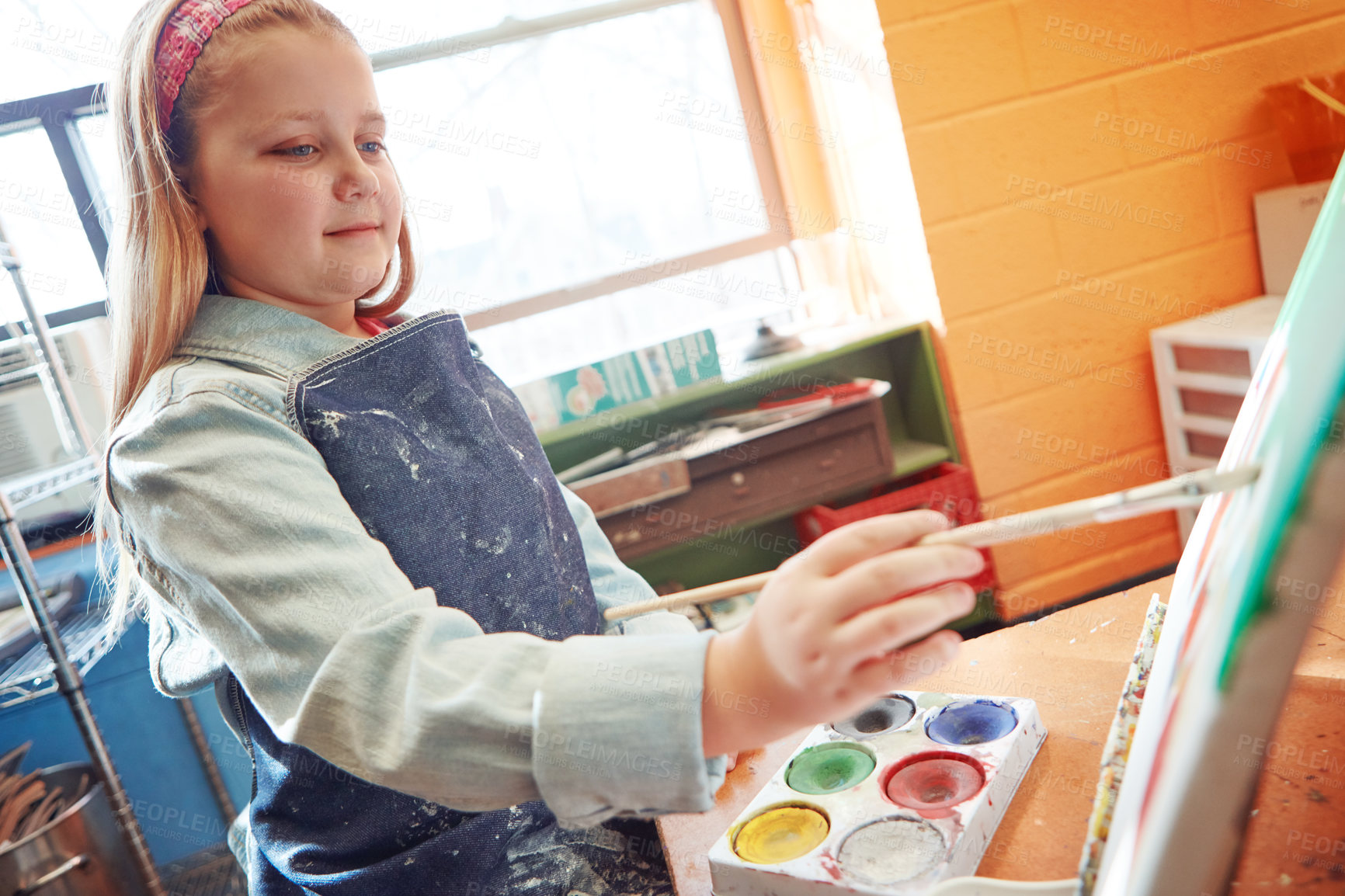 Buy stock photo Shot of a young schoolgirl in an art class