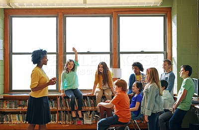 Buy stock photo Education, learning and student with questions for teacher in middle school classroom. Library, scholarship group and girl learner raising hand to answer question, studying or help with black woman.