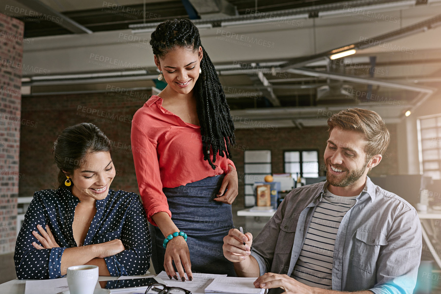 Buy stock photo Shot of a group of colleagues having a brainstorming session in a modern office