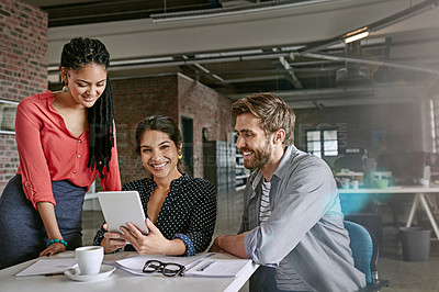 Buy stock photo Shot of a group of colleagues having a brainstorming session in a modern office