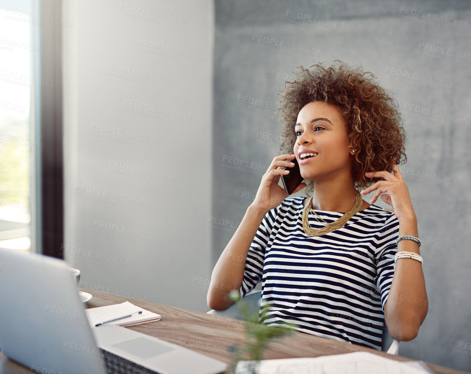 Buy stock photo Shot of a young woman talk on the phone while sitting at a desk at home