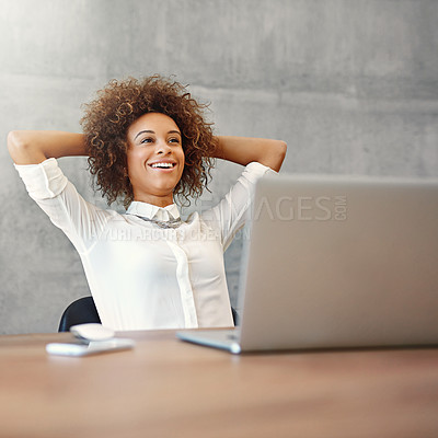 Buy stock photo Shot of a smiling young woman working on a laptop at home